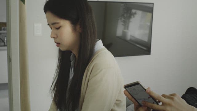 Woman with a gloomy face sitting in a bright room