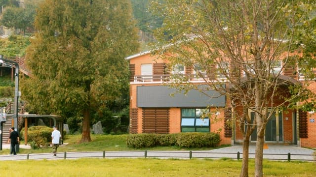 Red brick building located in the park