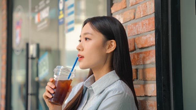 Young woman relaxing and drinking coffee