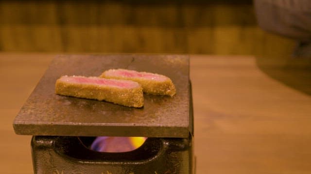 Gyukatsu Being Cooked in a Brazier