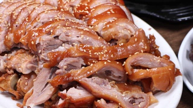 Pig's feet, sundae, and soft tofu stew served on a restaurant table