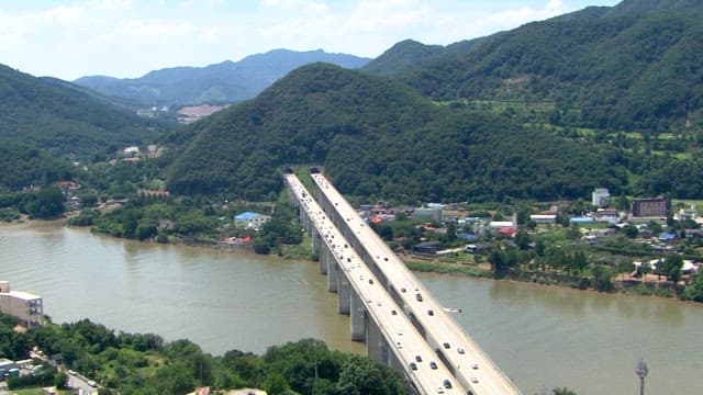 Aerial View of Busy Bridge over River Valley