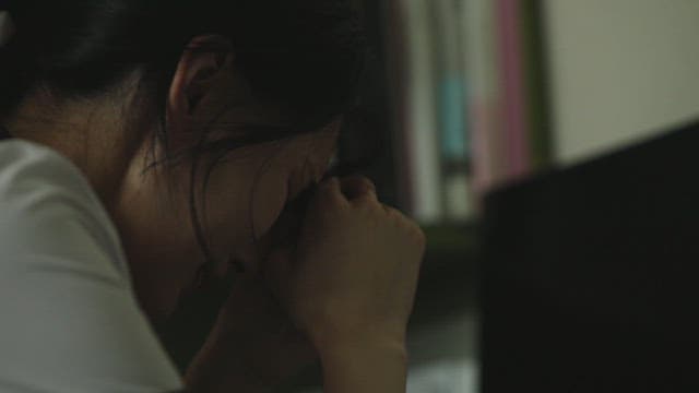 Student with her head down struggling