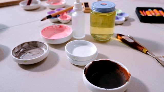 Artistic Tools and Paints on a Workspace