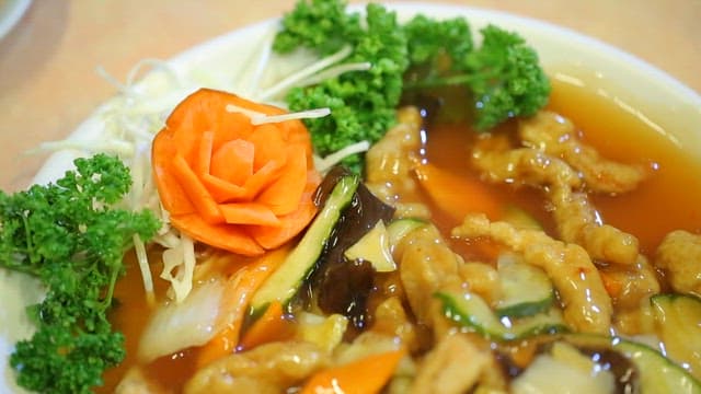 Sweet and sour pork soaked in sauce