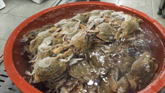 Sorting Charcoal and Crabs in a Kitchen
