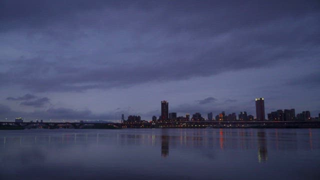 Twilight Cityscape Reflected on Calm River