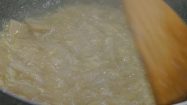 Cooking Bamboo Shoot Egg Soup in a Hot Pan with a Spatula