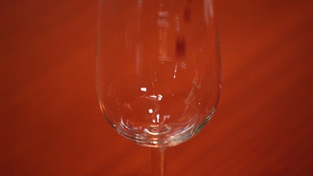 Pouring Red Wine into a Glass