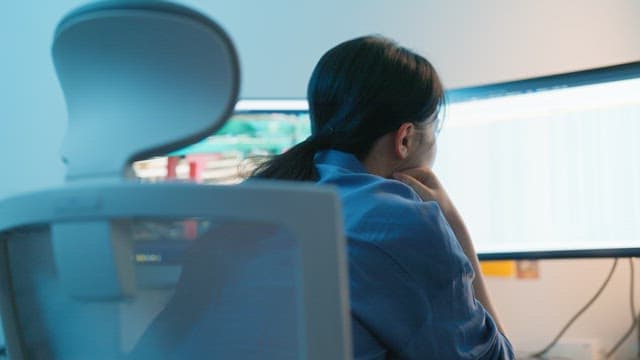 Person working at a computer in an office