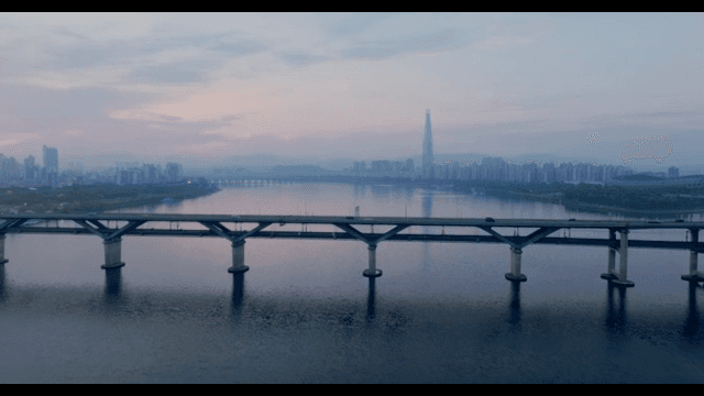 Serene river with a city skyline