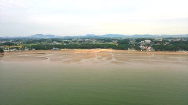 Aerial View of Coastal Town and Tidal Flats