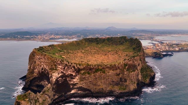 Volcanic island with a crater and ocean