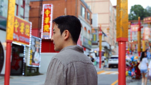 Man fighting on a busy street
