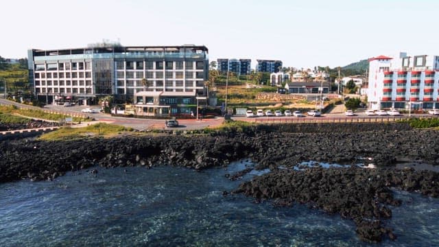 Coast with modern buildings and sea