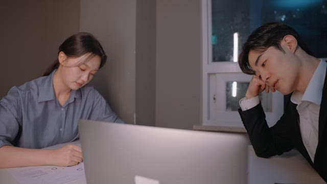 Two colleagues working late at night