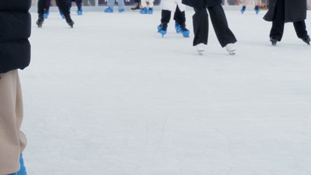 People ice skating on a rink