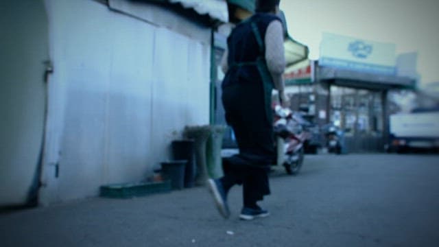 Person Running around the City's Shopping Alleys