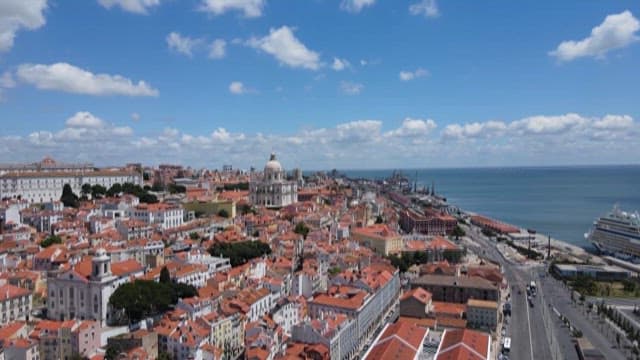 Quaint Town with Red Rooftops Under a Blue Sky