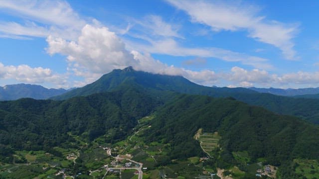 Vast mountain landscape under a blue sky