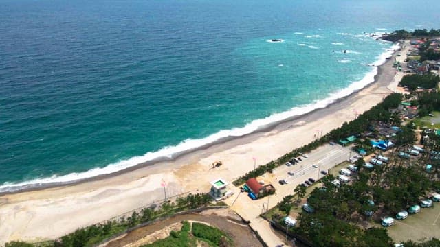 Scenic beach with turquoise waves