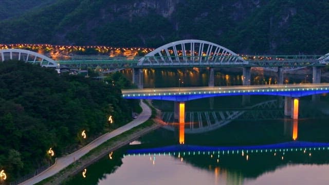 Bridges over a calm river at dusk