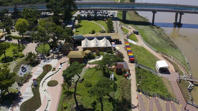 View of the park full of green and colorful structures on a sunny day