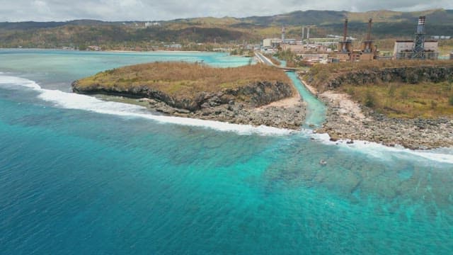 Coastal landscape with factories and industrial facilities