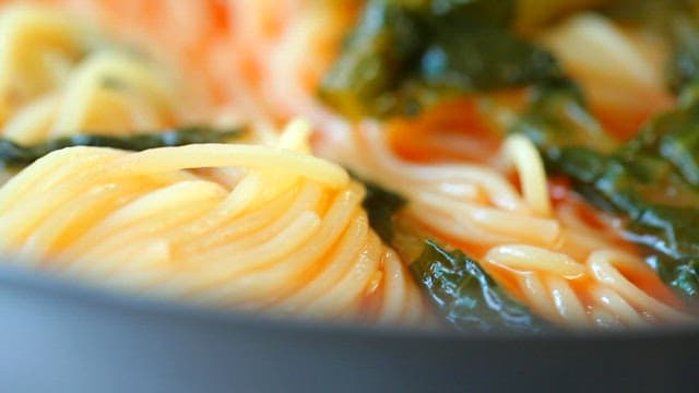 Close-up of yeolmu noodles in a red broth
