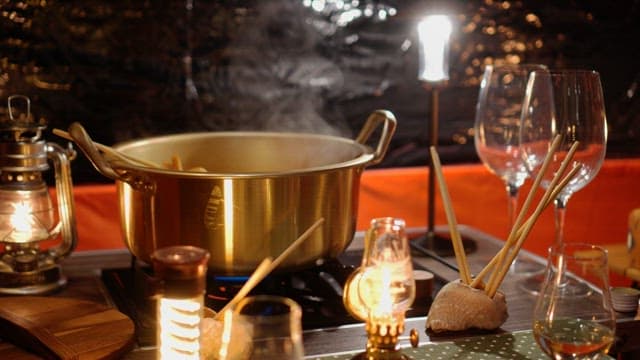 Fish cake soup inside the tent is boiling deliciously in a pot
