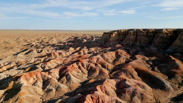 Vast desert landscape with rocky formations