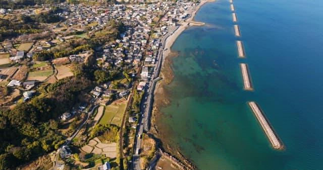 Coastal village with ocean and mountains