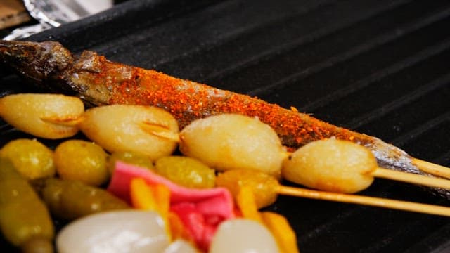 Grilled golden brown garlic and ginkgo nut skewers