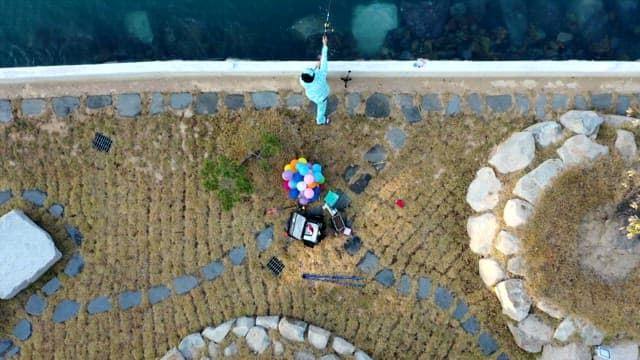 Person fishing by the seaside