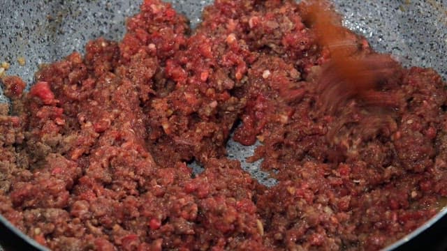 Ground beef being cooked in a pan