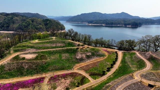 Serene lake surrounded by lush mountains
