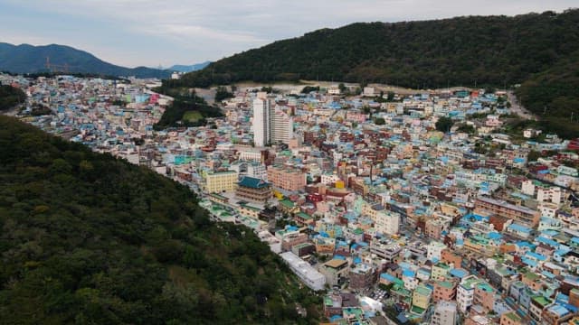 Colorful residential area nestled on a green hill