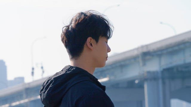 Man checking smartwatch outdoors