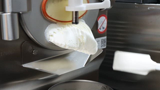 White cream coming out of the machine