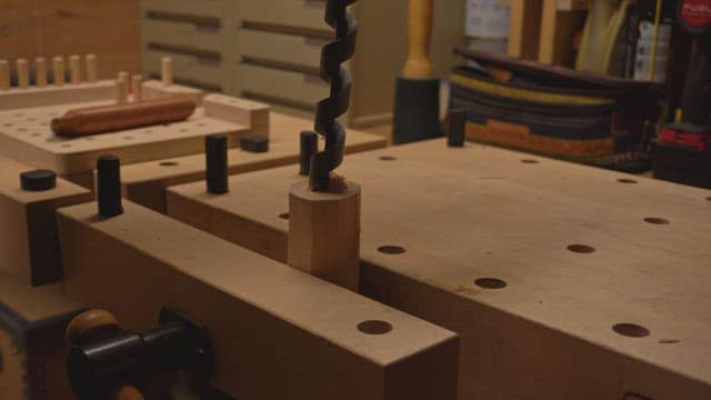 Wood being drilled in a workshop
