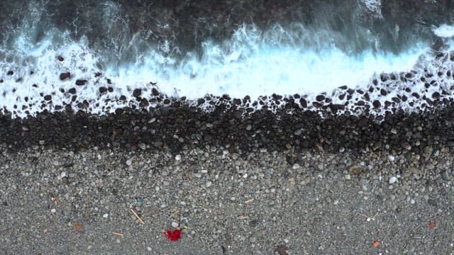 View of waves crashing onto a rocky shore