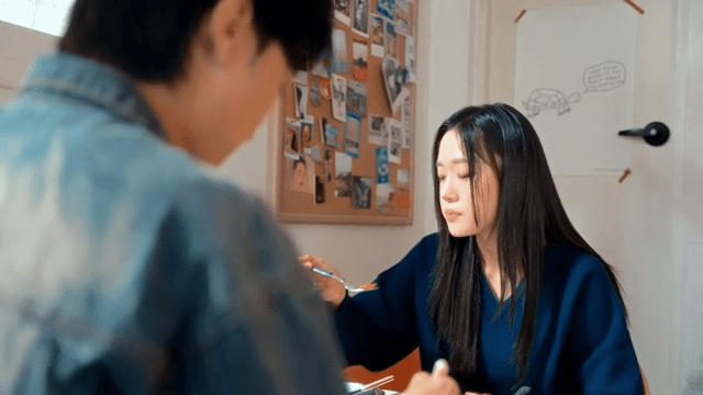 Two people enjoying pizza indoors