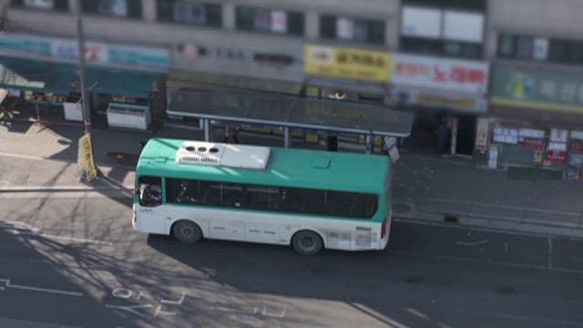 Busy Traffic in the City with City Bus and Cars