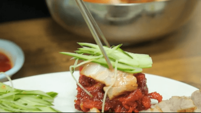 Sliced boiled pork with cucumber and sliced raw pollack salad
