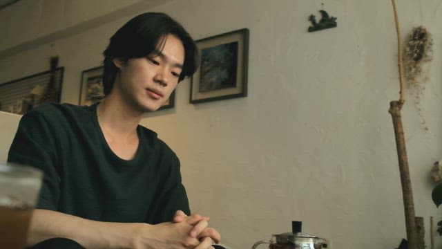 Man enjoying tea in a cozy cafe
