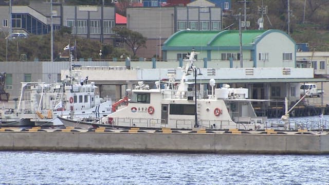 Fishery Patrol Ship Anchored at the Harbor Dock