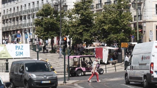 Daytime at Busy City Intersection with People and Vehicles