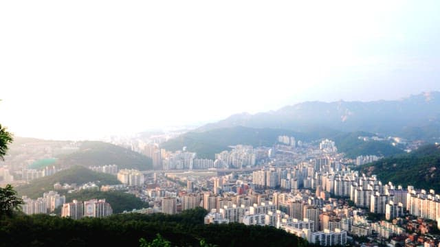 Overlooking a sprawling cityscape at dusk