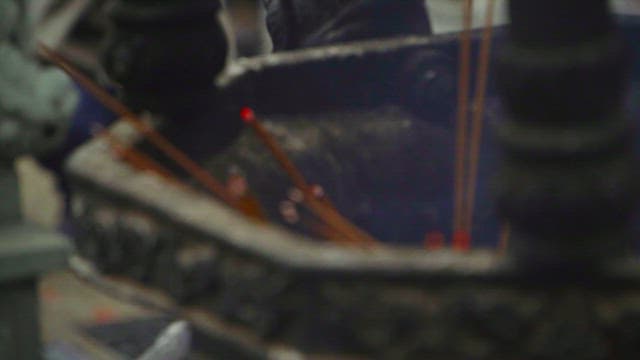 Incense Sticks Burning in a Holder