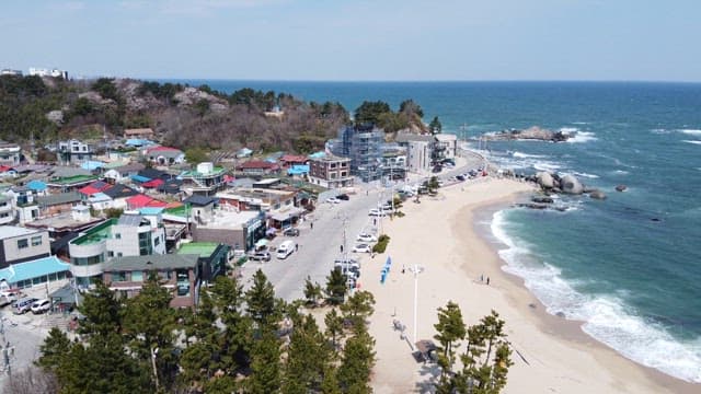 Coastal Village Alongside a Sandy Beach
